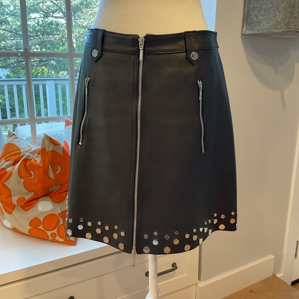 Elie Tahari black leather skirt with studs.